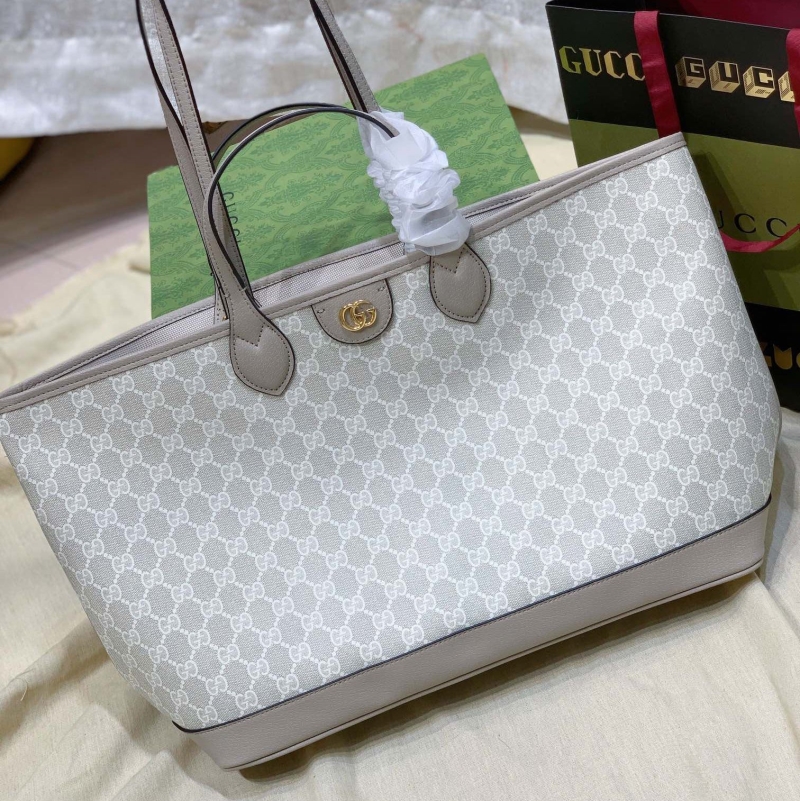 G*u*i shopping bags
